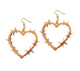Heart-shaped barbed wire earrings on a white background
