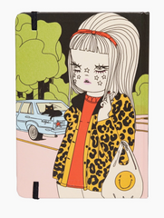 Notebook with a colorful illustration of a person wearing a leopard print jacket and holding a bag with a smiley face.